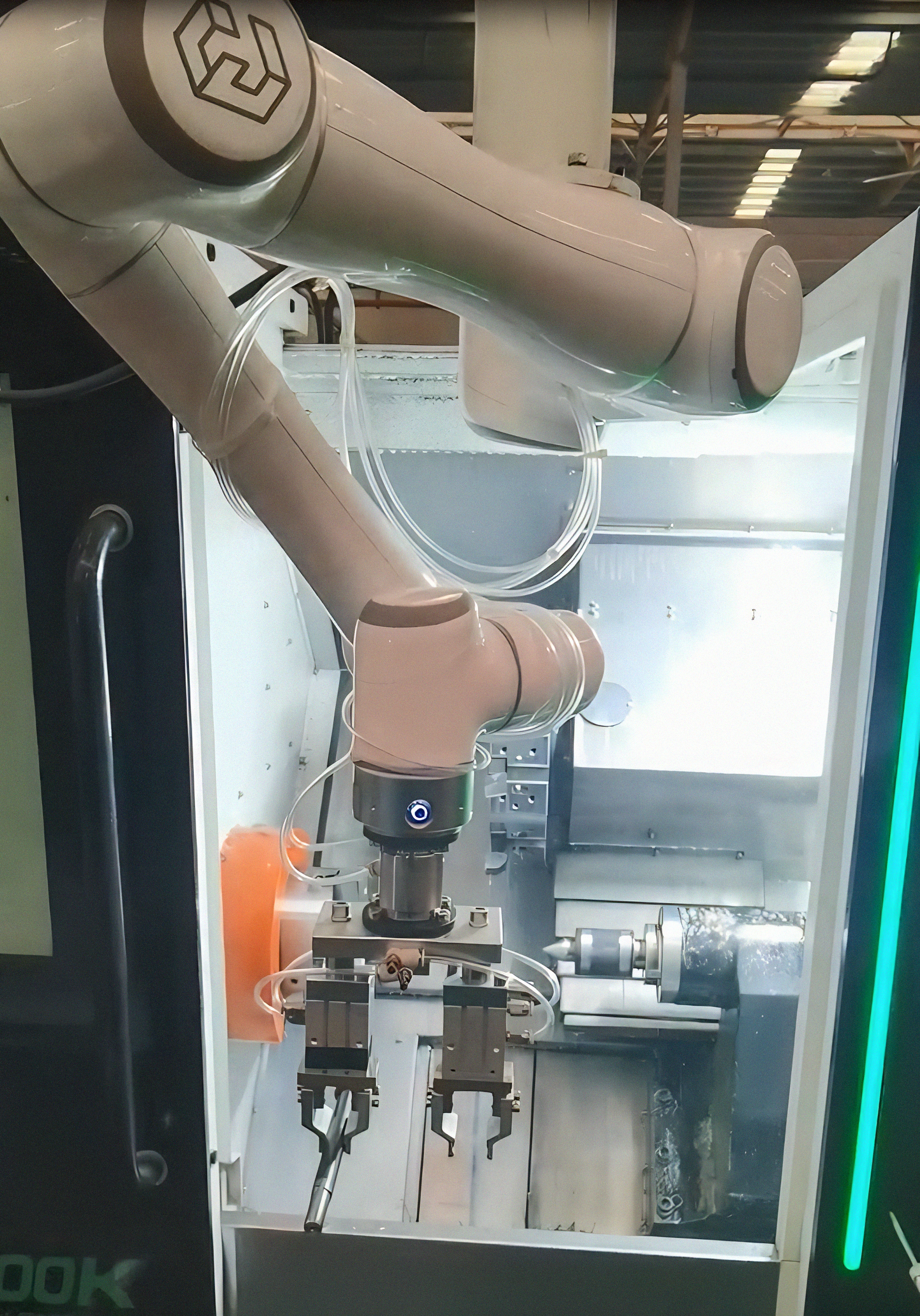 Robot arm with mechanical grippers in a factory setting
