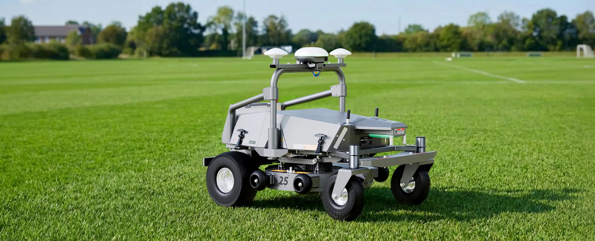 FJD RM21 robotic mower on a sports field