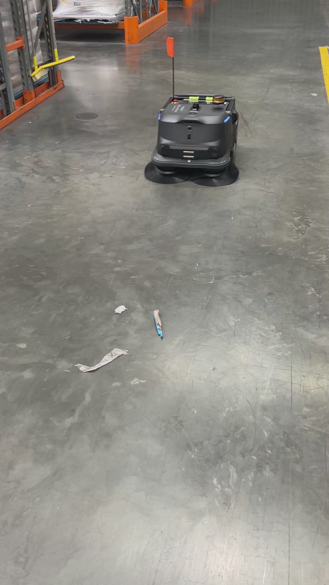 MT1 Sweeping Robot in action cleaning debris in a workshop From Robot Solutions QLD
